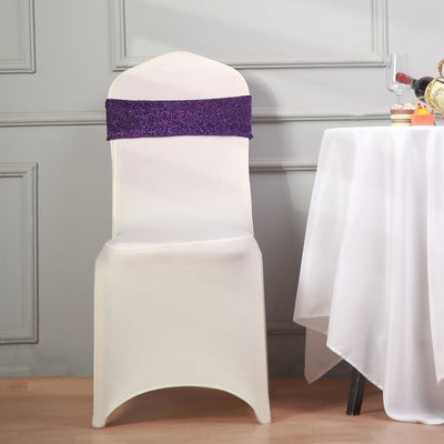 Elegant white chair cover with purple sash for events and weddings.