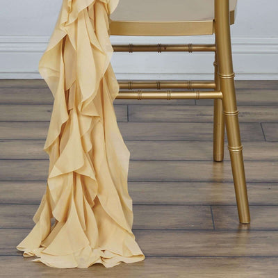 Soft yellow ruffled fabric draped over a gold chair leg.