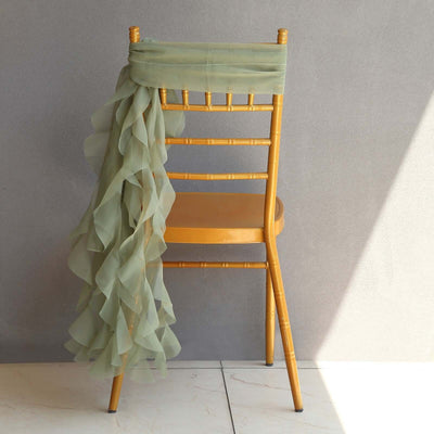 Gold chiavari chair with green chiffon draping elegantly on the back.