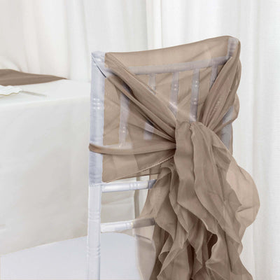 Elegant taupe chair tie draped on a white chiavari chair.