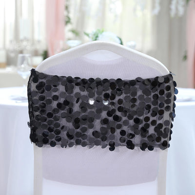 Black sequin chair cover draped on a white chair in an elegant setting.