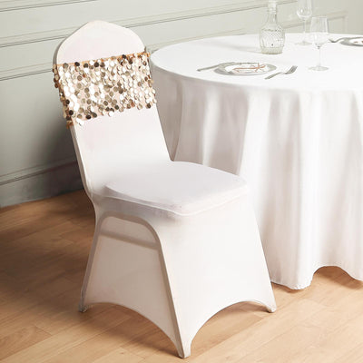 Elegant white chair with decorative beaded draping, set near a dining table.