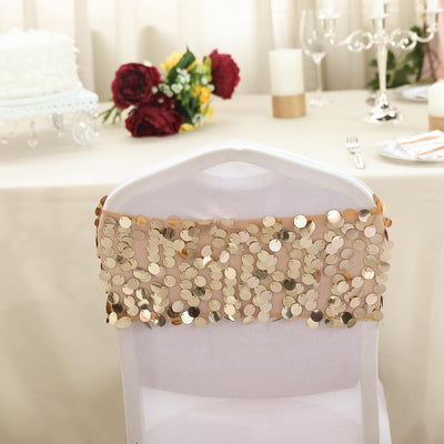 Gold sequin chair sash on a white chair at an elegant event setting.