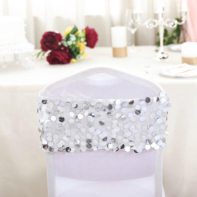 Silver sequin chair cover with elegant design for events and celebrations.