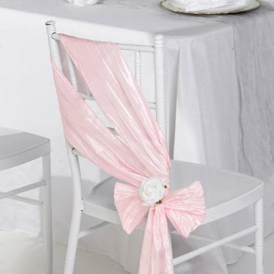 Pink chair sash with a rose decoration, perfect for weddings or events.
