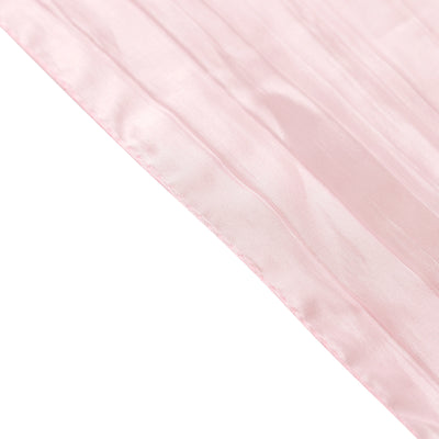 Sheer pink fabric draping with soft texture and gentle sheen.
