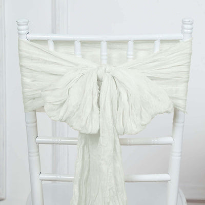 White chiffon chair tie draped elegantly on a white chiavari chair
