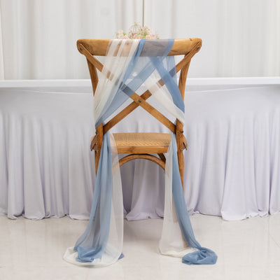 Elegant wooden chair draped with blue and white fabric.