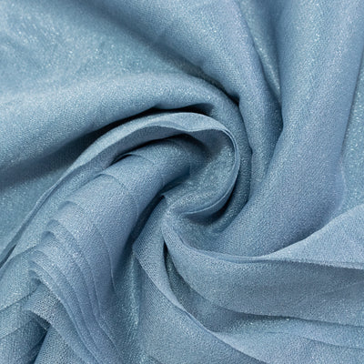 Light blue shimmering fabric draped elegantly in soft folds.