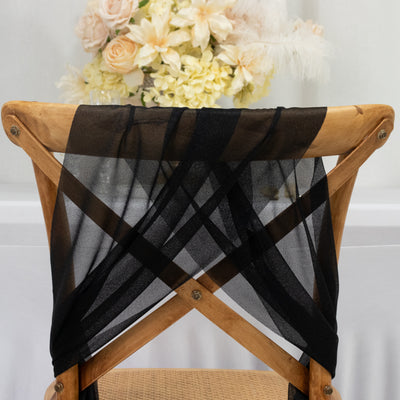 Black sheer chair sash draped elegantly over a wooden crossback chair.