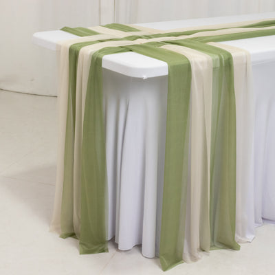 Elegant table runner in soft green and beige on a white table.