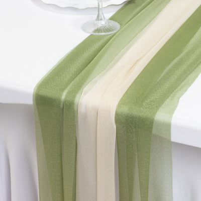 Elegant green and beige table runner draped on a white table.