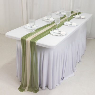 Elegant table setting with green and beige runners and glassware