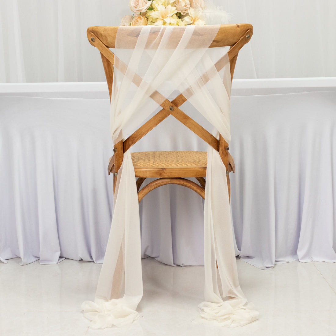 Elegant sheer chair draping for weddings or events.