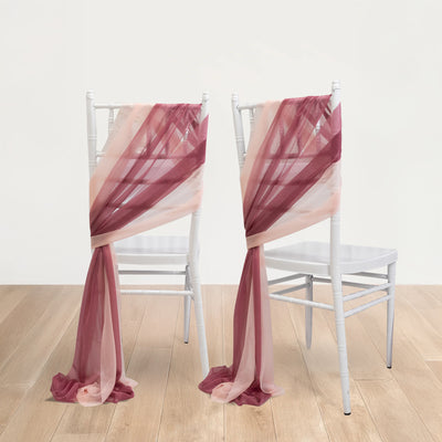 Elegant sheer chair sashes in burgundy and blush draped on white chairs.