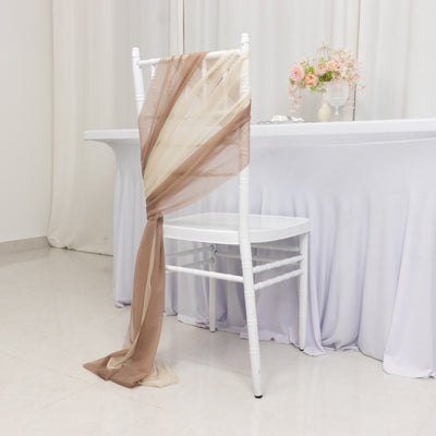 Elegant chair draping in soft brown and cream fabric for event decor.