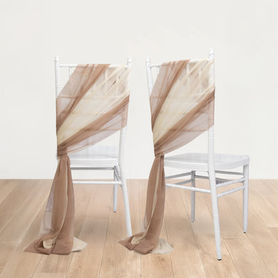 Elegant sheer fabric draping on white chairs in a minimalist setting.