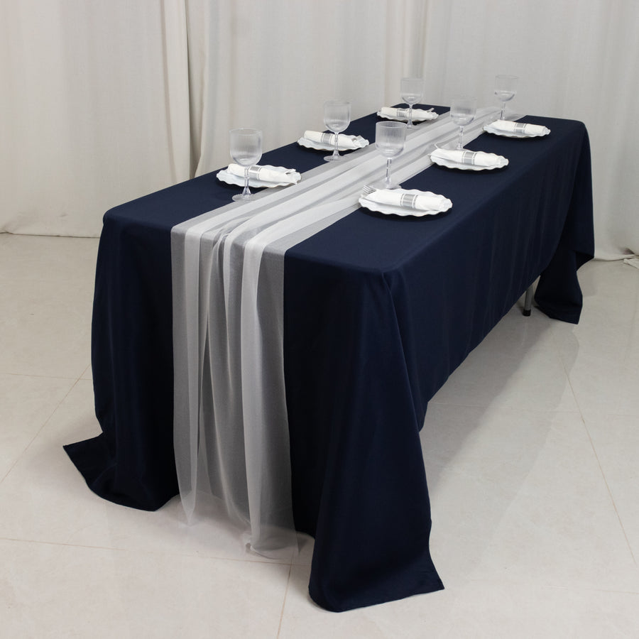 White sheer table runners styled on event table for baby shower table decor