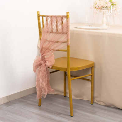 Gold chiavari chair with blush tulle draping
