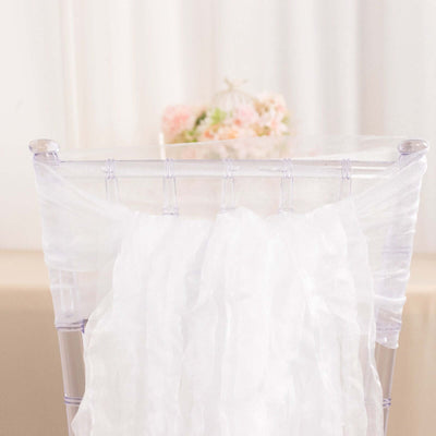 White sheer chair sash draped elegantly over a clear chiavari chair.