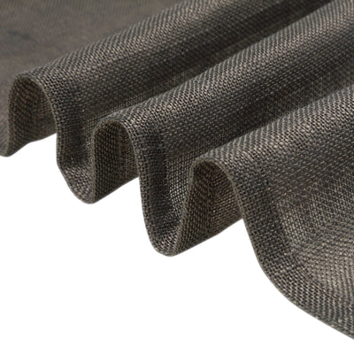 Textured dark fabric draped in folds showcasing its rich detail.