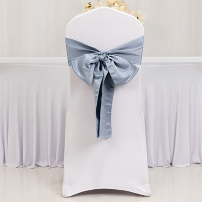 White chair cover with a light blue satin bow.