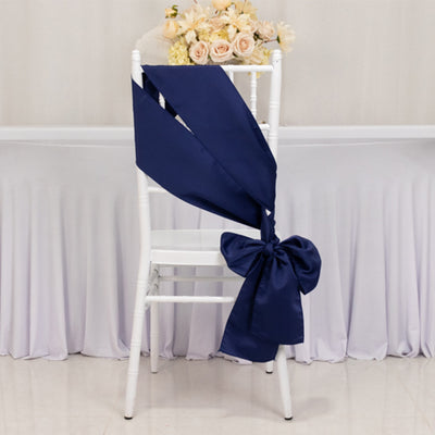 Navy chair sash with bow on a white chiavari chair