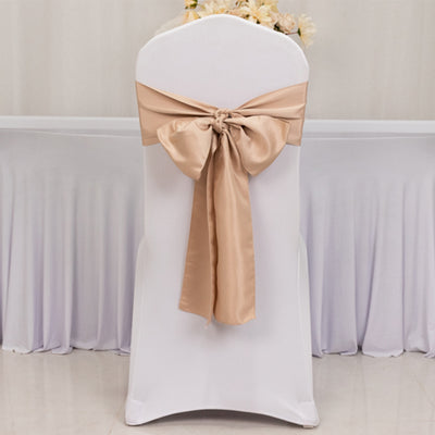 Chair cover with beige satin bow, perfect for weddings and events.