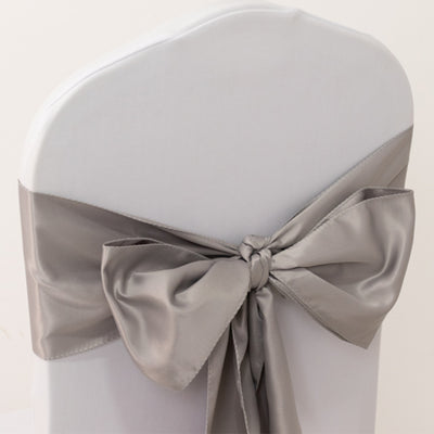 Silver satin chair cover bow tied elegantly.