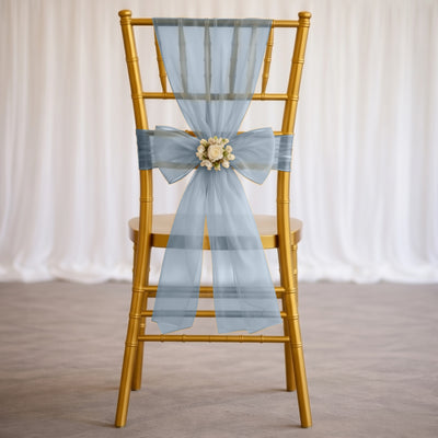Gold chiavari chair with light blue sheer bow and floral centerpiece