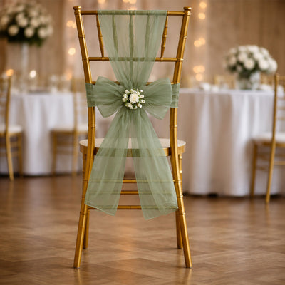 Gold wedding chair with sage green tulle and floral sash decoration