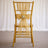 Gold chiavari chair with a yellow bow and floral accent on a plain backdrop.