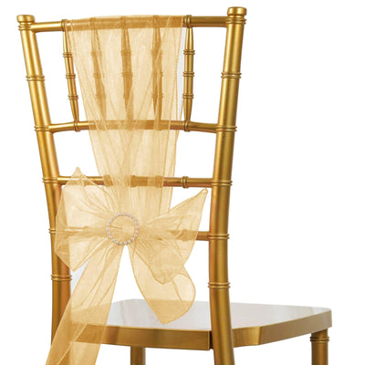 Gold chiavari chair with sheer gold sash and bow detail