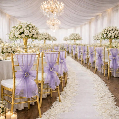 Elegant wedding reception with white roses, lavender chairs, and gold decor