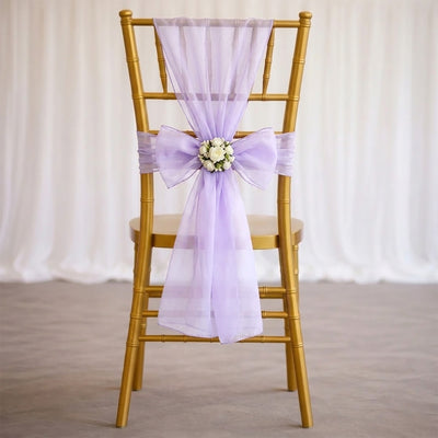 Gold chiavari chair with lavender sheer bow and floral wedding decor