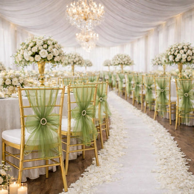 Elegant wedding reception setup with gold chairs and floral arrangements.
