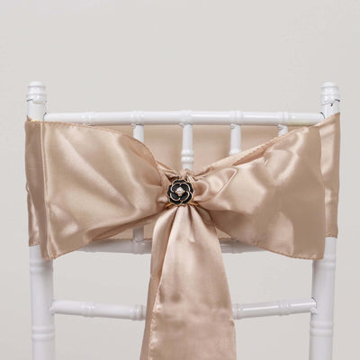 Satin chair sash with decorative flower embellishment in champagne color