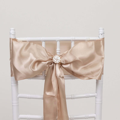 Champagne satin chair sash with a decorative flower buckle