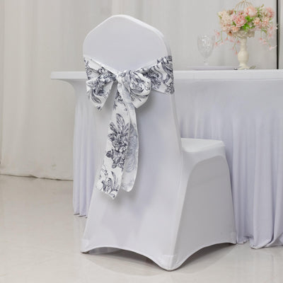 Elegant white chair cover with floral bow for event decor.