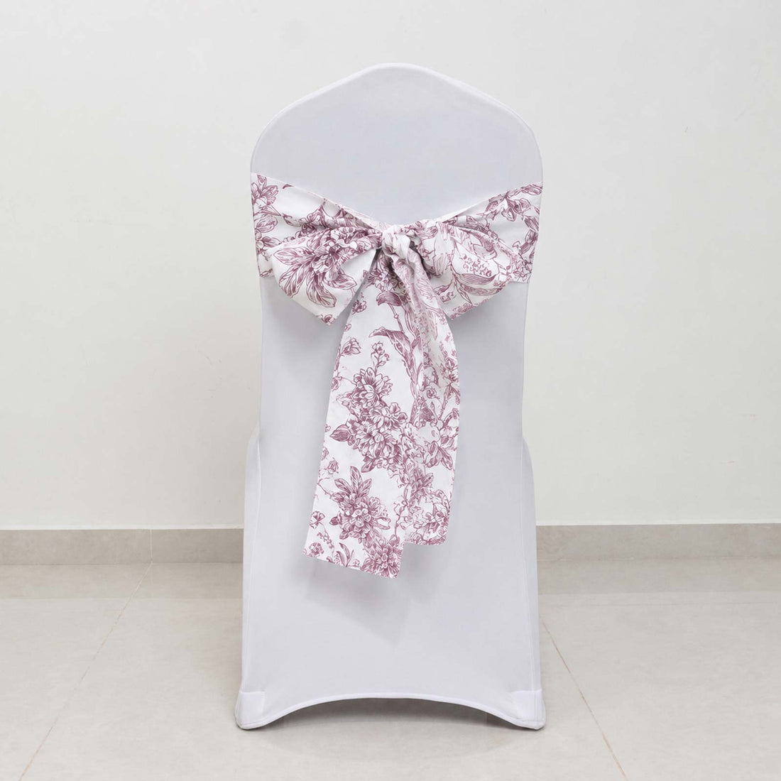 White chair cover with pink floral bow sash decoration