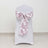 White chair cover with pink floral bow sash decoration