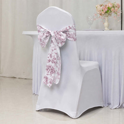 White banquet chair cover with pink floral bow decor at elegant event table