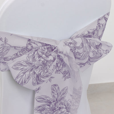 Purple floral chair sash tied elegantly on a white chair.