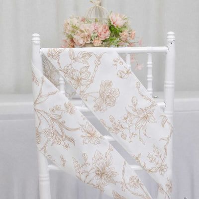 White floral chiffon chair sash on a wedding chair with pastel flowers background