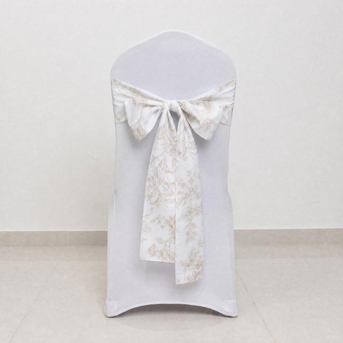 White Chiavari chair cover with floral bow sash for wedding decor