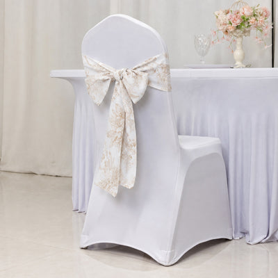 White banquet chair cover with floral sash at elegant event table