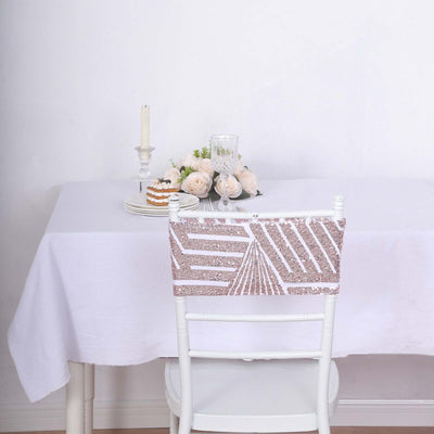 Elegant table setting with floral centerpiece and decorated chair.
