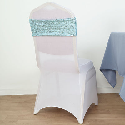 Elegant white chair with a turquoise sequin cover against a plain background.