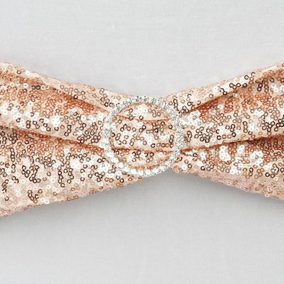Rose gold sequin hair accessory with a decorative circular buckle