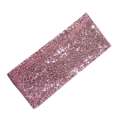 Pink sequin fabric swatch, perfect for crafts and fashion projects.